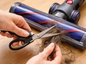 Cutting tangled hair from vacuum roller